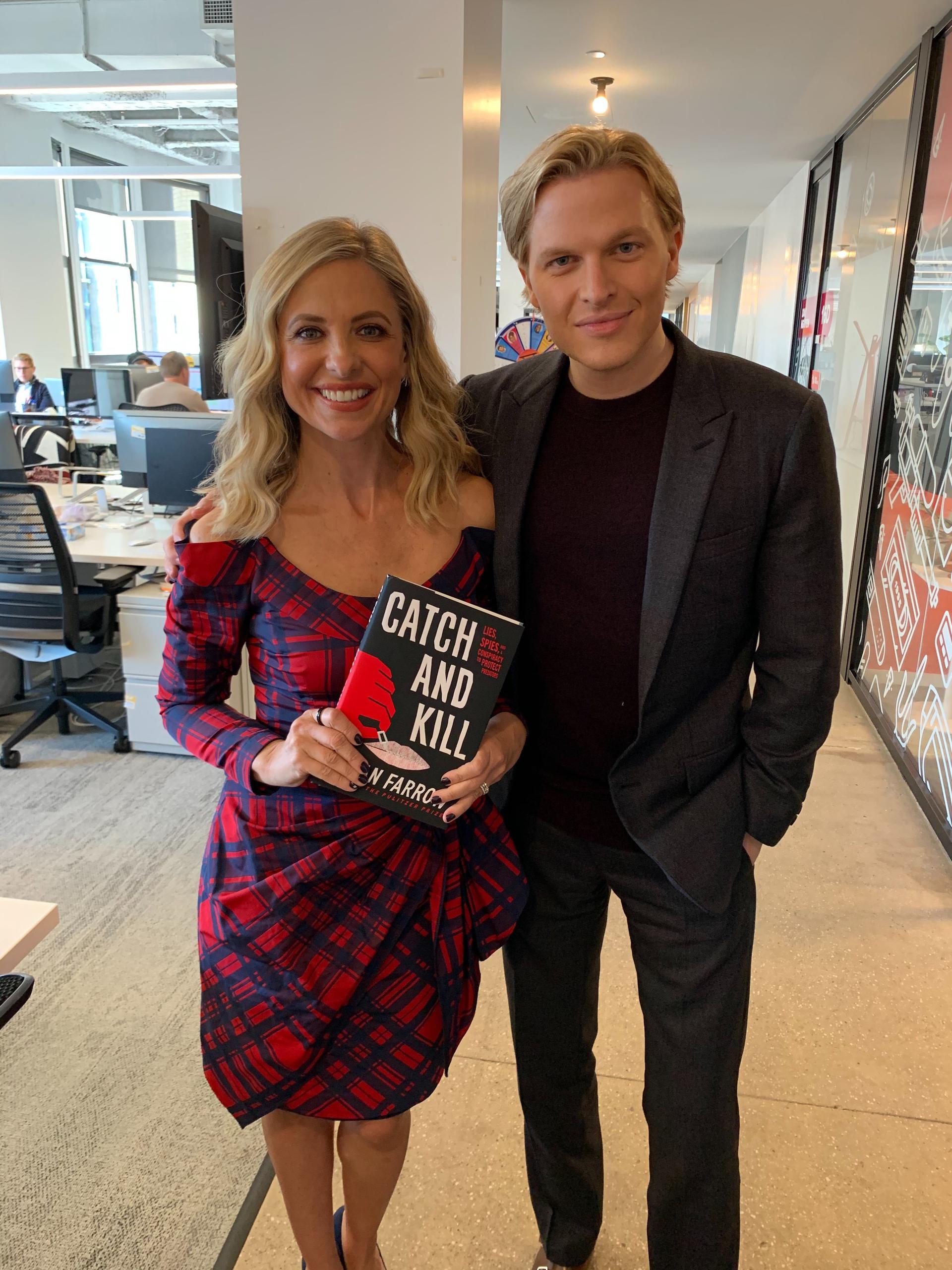 Sarah Michelle Gellar and Ronan Farrow smiling at the camera